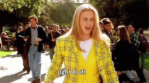 Woman in Yellow Plaid Jacket Shouting to Crowd