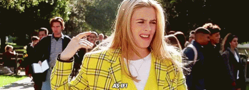 Woman in Yellow Plaid Jacket Talking to Crowd