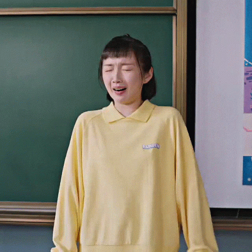 Woman In Yellow Rainbow Sweatshirt GIF