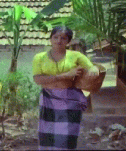 Woman in Yellow Shirt and Purple Skirt
