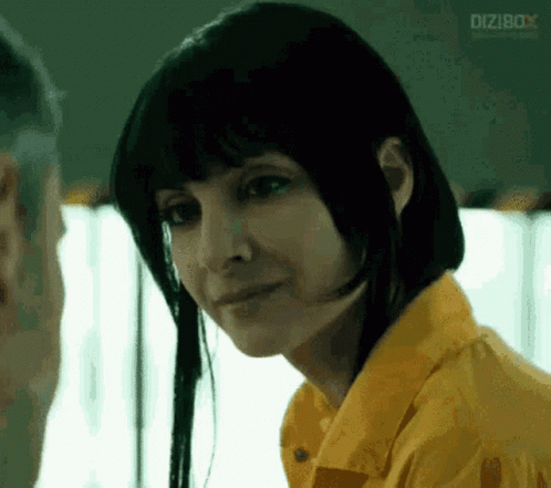 Woman In Yellow Shirt Looks At Man In Prison GIF