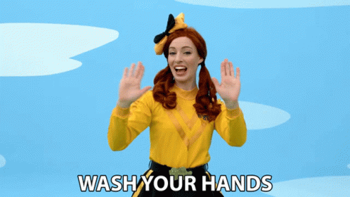Woman in Yellow Shirt Saying Wash Your Hands