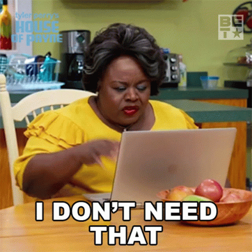 Woman in Yellow Shirt Using Laptop Says I Don't Need That