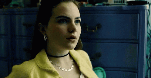 Woman In Yellow Sweater And Choker GIF