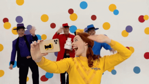 Woman In Yellow Sweater Saying Wiggles GIF