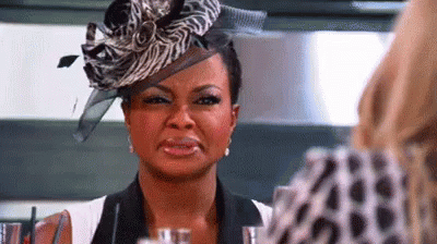 Woman in Zebra Print Hat Crying at Mirror