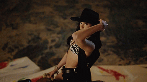 Woman in Zebra Print Top and Black Cowboy Hat
