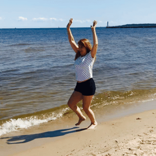 Woman Jumping On Beach GIF