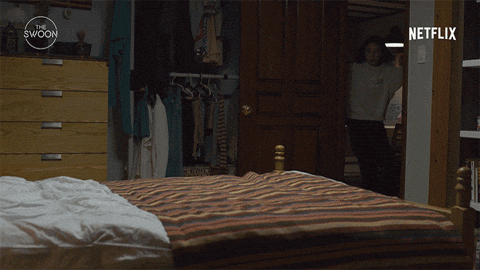 Woman Jumping on Bed with Netflix Logo