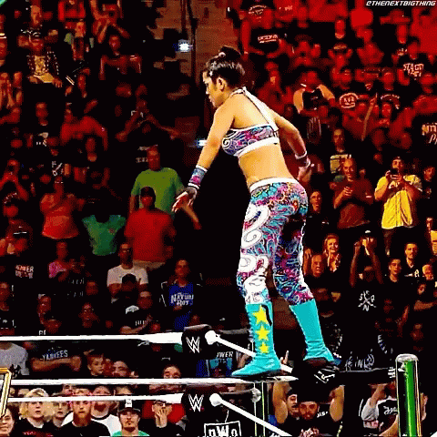 Woman Jumping Over Wrestling Ring
