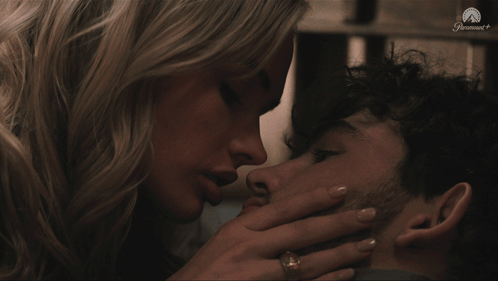 Woman Kissing Man on Cheek