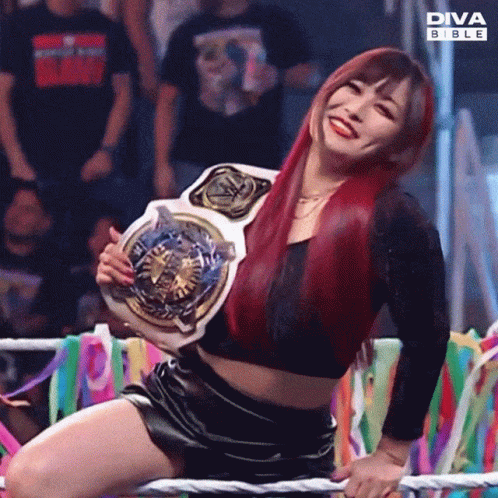 Woman Kneeling in Ring Holding Diva Bible Belt