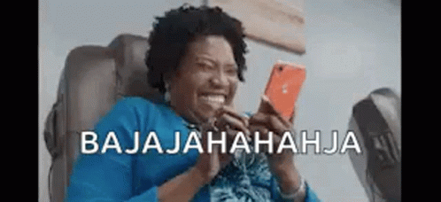 Woman Laughing at Phone in Chair