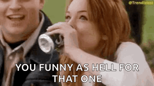 Woman Laughing Drinking From Can Man Laughing Behind GIF