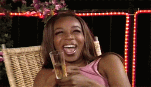 Woman Laughing Holding Beer