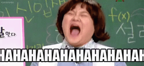Woman Laughing In Front Of Blackboard GIF