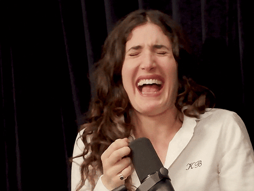 Woman Laughing Wearing XB Shirt