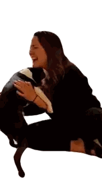 Woman Laughing While Hugging Dog