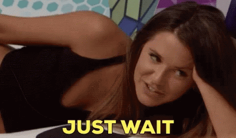Woman Laying Down Saying Just Wait in Yellow