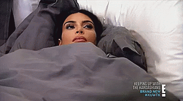 Woman Laying In Bed Under Blanket Head On Pillow GIF