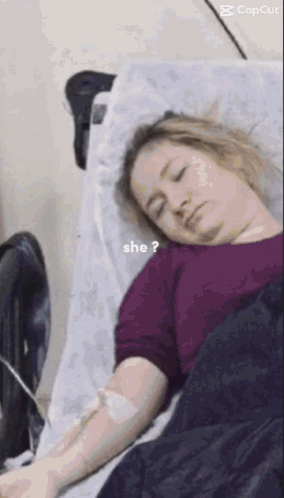 Woman Laying in Hospital Bed With IV and Question Mark