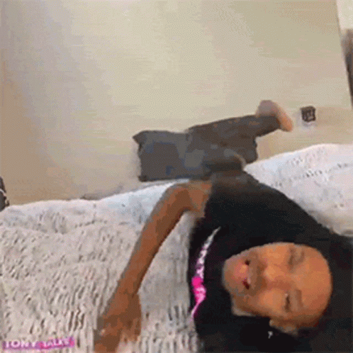 Woman Laying On Bed Eyes Closed GIF