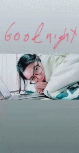 Woman Laying on Bed Saying Goodnight