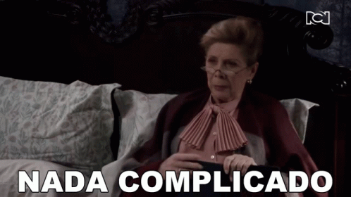 Woman Laying on Bed Saying Nada Complicado