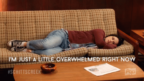 Woman Laying on Couch Saying I'm Just a Little Overwhelmed Right Now