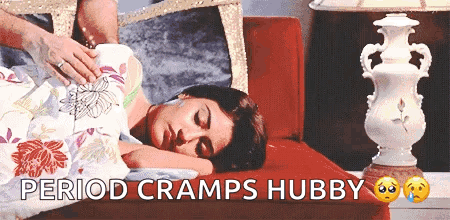 Woman Laying on Couch Saying Period Cramps Hubby
