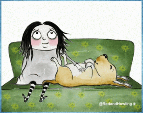 Woman Laying on Couch With Dog