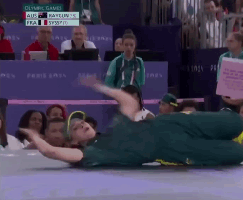 Woman Laying on Floor at Olympics