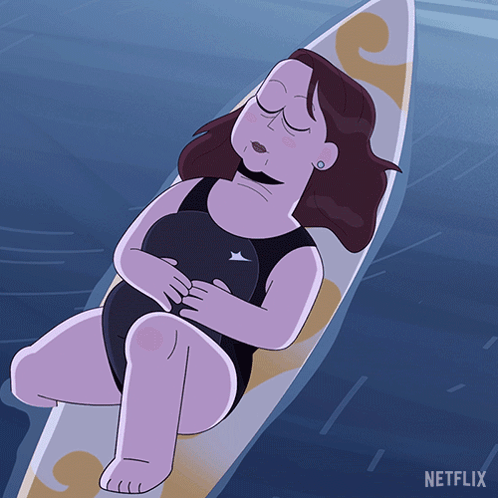 Woman Laying on Surfboard With Netflix