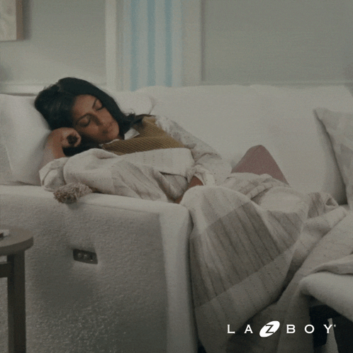 Woman Laying On White Couch Lazy Mode GIF