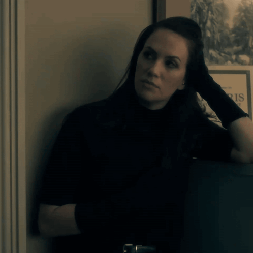 Woman Leaning Against Wall Saying Paris GIF