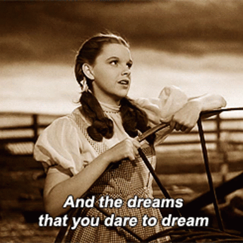 Woman Leaning on Railing with Dream Words