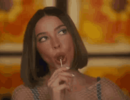 Woman Licking Lollipop