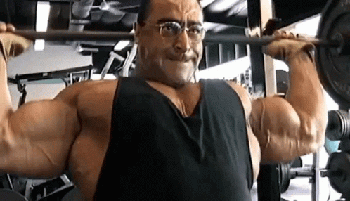 Woman Lifting Dumbbells In Gym GIF