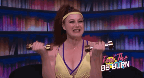 Woman Lifting Dumbbells Saying Feel the BB Burn
