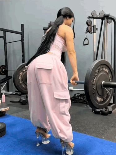 Woman Lifting Heavy Weight Barbell