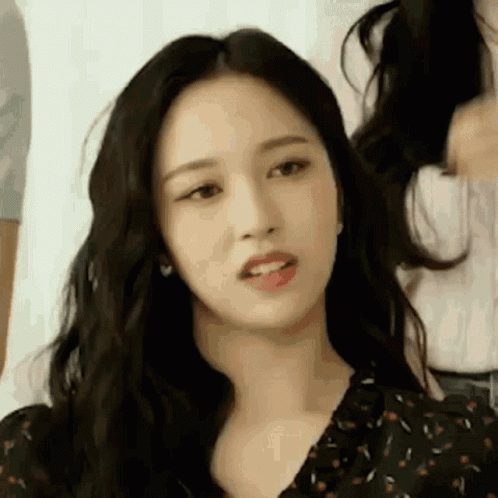 Woman Looking at Camera with Long Black Hair