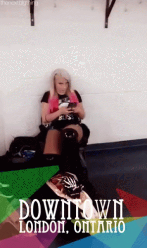 Woman Looking at Phone on Couch Downtown London Ontario