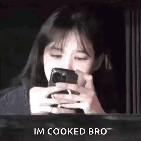 Woman Looking at Phone Saying I'm Cooked Bro