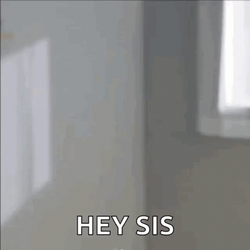 Woman Looking in Mirror Saying Hey Sis