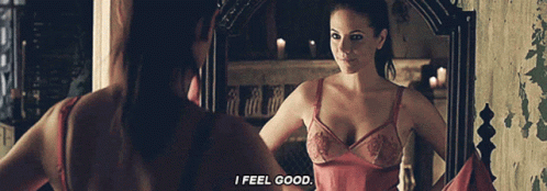 Woman Looking in Mirror Saying I Feel Good