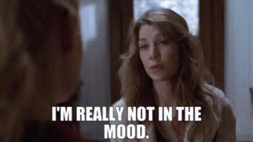 Woman Looking in Mirror Saying I'm Really Not in the Mood