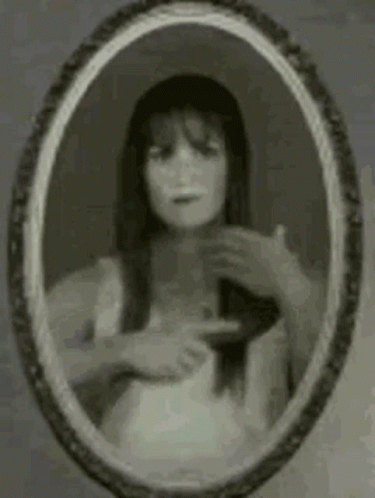 Woman Looking in Mirror