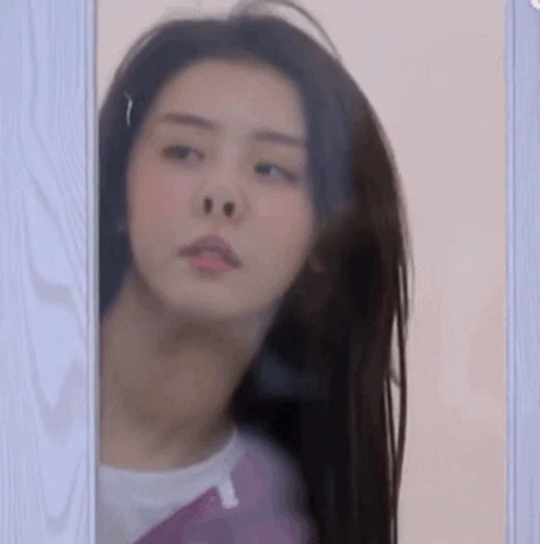 Woman Looking Out Window