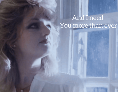 Woman Looking Out Window Saying And I Need You More Than Ever