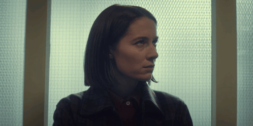 Woman Looking Out Window with Grid